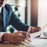 Man reviewing resumes