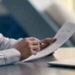 Executive reviews a credit background check on a potential new hire.